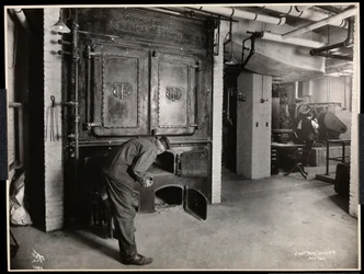 Interior view of men working in the furnace room at Parke, Davis and Co., chemists, Hudson and Vestry Streets, New York